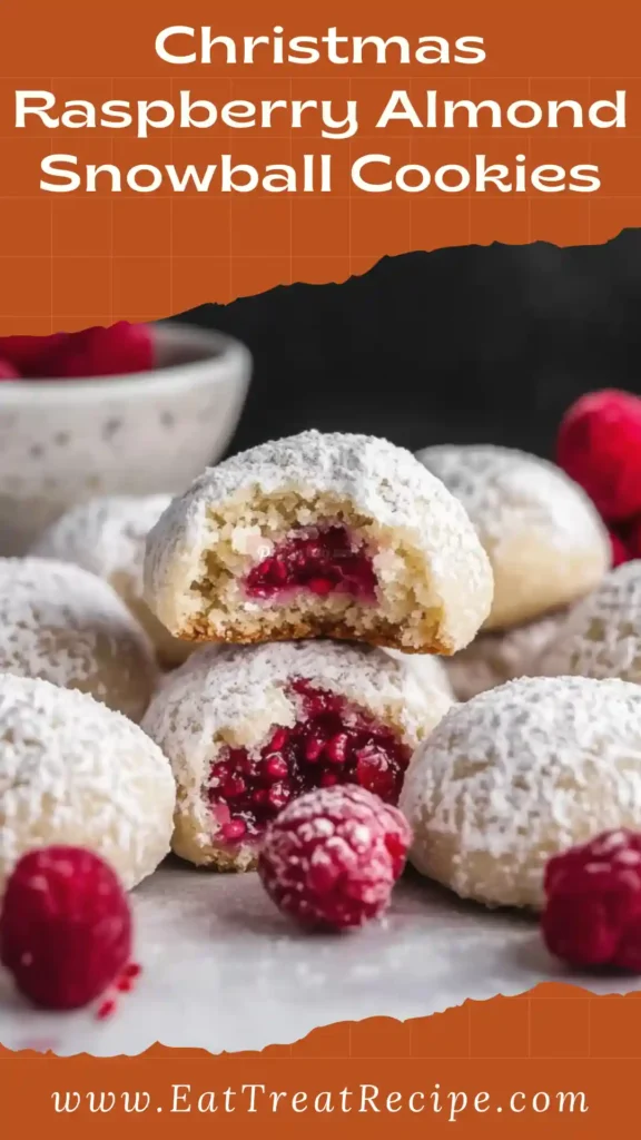 Christmas Raspberry Almond Snowball Cookies with raspberry filling and powdered sugar